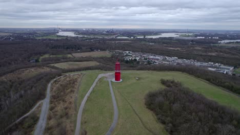 Halde-Rheinpreussen-Mining-Lamp-drone-orbit-with-Rhine-river-in-background,-overcast-weather