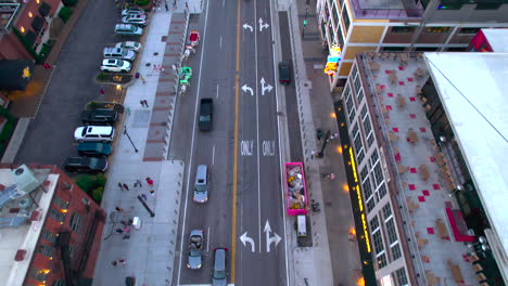 Aerial-view-over-the-Broadway-street,-revealing-the-Cumberland-river-in-Nashville,-USA---tilt,-drone-shot