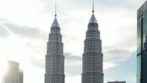 unique-macro-aerial-shot-of-the-Kuala-Lumpur-Petronas-Tower-as-the-sun-flares-behind-the-building-during-sunset-in-Malaysia