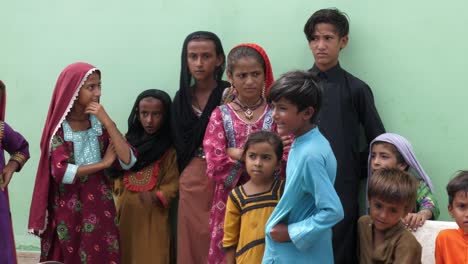 Numerous-children-standing-in-the-line-in-flood-relief-camp-to-receive-the-aid-in-Sindh,-Pakistan