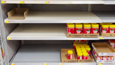 Half-empty-peanut-butter-section-at-Walmart