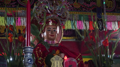 Illuminated-Buddha-figure-in-Whale-temple-in-Mui-Ne,-Vietnam