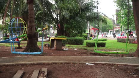 swaying-swing-in-city-park-in-semarang,-central-java,-indonesia,-June-7,-2022