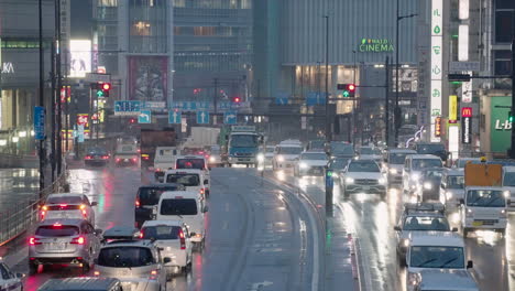 Heavy-Traffic-At-Shinjuku-With-Shinjuku-Wald-9-Cinema-In-The-Background-During-Pandemic-In-Tokyo,-Japan