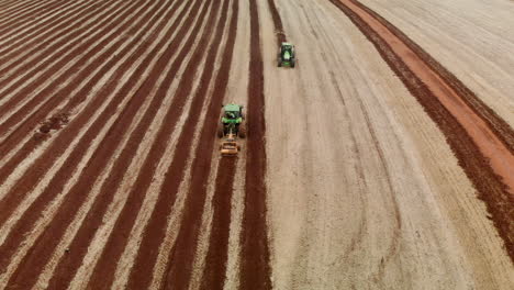 Tractor-plowing-the-land,-preparing-the-soil-for-planting