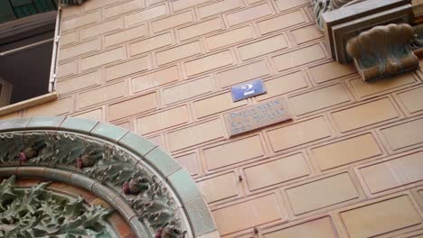 Signage-With-The-Name-Of-Architect-Charles-Klein-On-Yellow-Ceramic-Wall-Of-Les-Chardons-Building