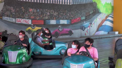 Visitors-enjoy-the-Bumper-Blaster-cars-ride-at-the-amusement-and-animal-theme-park-Ocean-Park-in-Hong-Kong