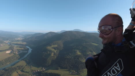 Two-male-gliders-enjoying-view-of-scenic-greenery-valley