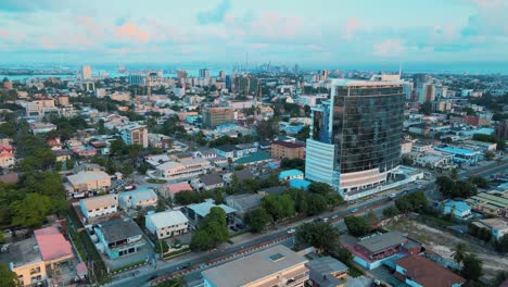 Cityscape-of-residential-buildings,-Helipad,-and-major-roads-during-sunrise