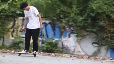 Boys-practice-skateboarding-in-an-abandoned-building-in-Denpasar,-Bali,-October-25,-2021