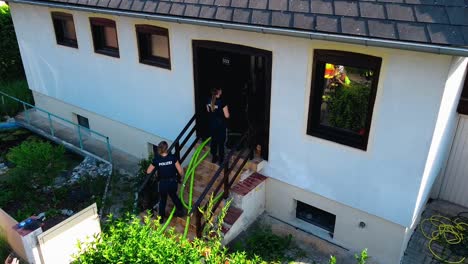 AERIAL---Cobra-Special-Task-Force,-police,-at-fire-in-Oberwaltersdorf,-Austria