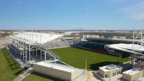 Birds-Eye-View-of-SeatGeek-Stadium,-Chicago-Skyline-in-Background