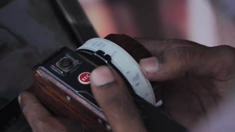 Close-Up-Of-Follow-Focus-Unit-Held-By-Focus-Puller