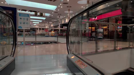 POV-Going-Up-Escalator-To-Third-Floor-At-As-Cancelas-Shopping-Center-In-Galicia,-Spain