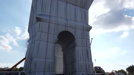 On-Ride-Shot-Of-The-Fully-Wrapped-Arc-de-Triomphe,-Artwork-From-Christo-and-Jeanne-Claude,-Paris-France