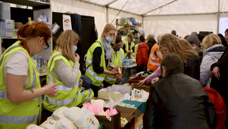 Volunteers-in-a-specially-built-tent-distribute-necessities-to-Ukrainian-war-refugees-at-Warsaw-West-railway-station-during-the-Russian-invasion-of-Ukraine