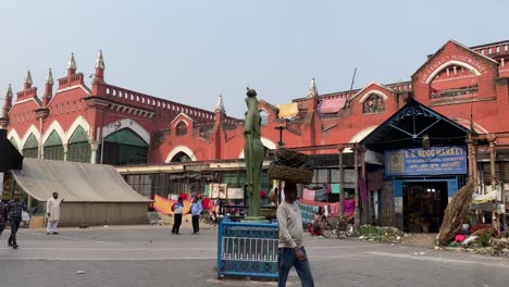 View-of-the-people-walking-in-front-the-new-Hogg-market's-entrance,-people-stay-very-busy-during-Christmas-time-at-this-place-in-Kolkata