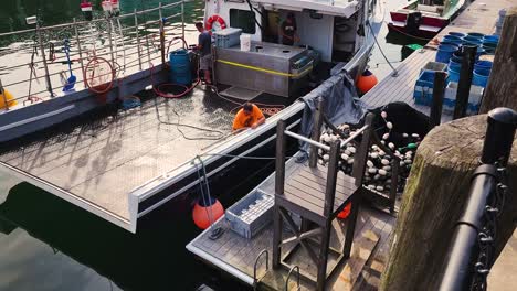 Men-working-on-fishing-boat-in-Portland-Maine-Harbor