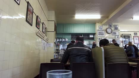 View-Of-Looking-Towards-Front-Of-Regency-Cafe-With-Patrons-Sitting-At-Tables-In-Westminster-On-29-March-2022