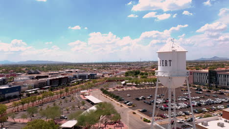 Closeup-of-landmark-water-tower-in-Gilbert-Arizona,-drone-orbit