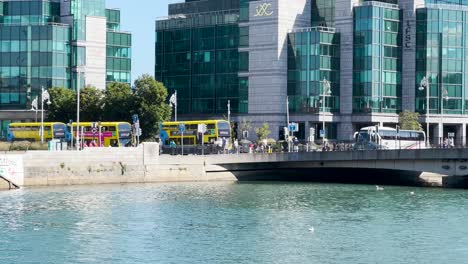 View-across-the-River-Liffey-onto-The-Talbot-Memorial-Bridge-in-Dublin-City-on-a-sunny-day-with-blue-skies