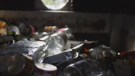 Container-full-of-glass-and-metal-cans