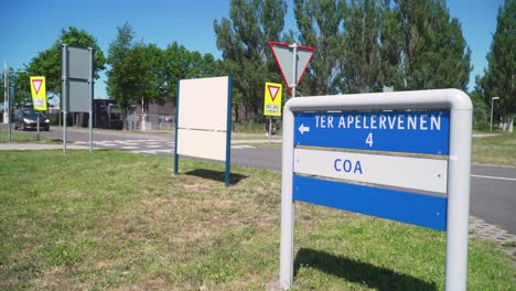 Signs-pointing-towards-the-Dutch-national-refugee-shelter-of-COA-in-Ter-Apel