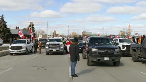 Protesters-on-the-street-in-Canada,-showing-the-national-flag