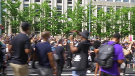 Walking-Through-Crowd-of-Protestors-during-Black-Lives-Matter-Protest-in-Brooklyn,-New-York