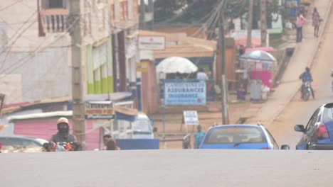 main-avenue-downtown-African-city-busy-with-traffic-and-pedestrians