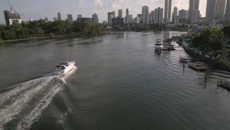 5-February-2023---Aerial-views-over-a-boat-on-Nerang-River-in-Surfers-Paradise,-Gold-Coast,-Queensland,-Australia