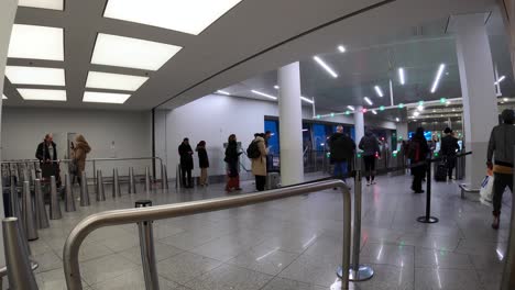 Travelers-Walking-To-Check-in-Counter-At-The-Terminal-Of-Brussels-Airport-In-Zaventem,-Belgium