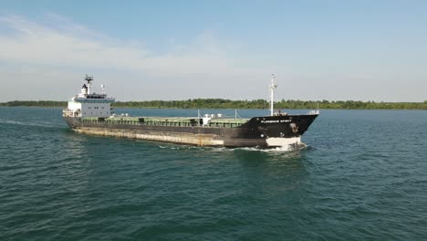 Smooth-Drone-Aerial-Following-the-Florence-Spirit-Freighter-on-the-Detroit-river-near-Wayndotte-Michigan