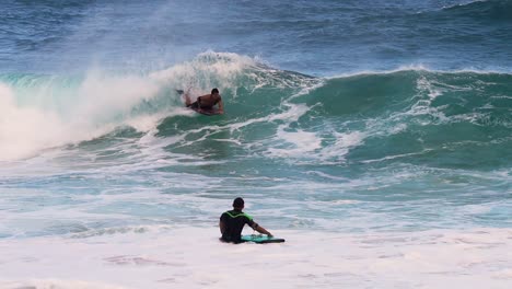 Slow-motion-shot-of-bodyboarder-gliding-across-wave,-onlooker-cheers