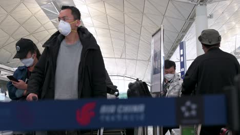 Travel-passengers-lining-up-at-a-Chinese-flag-carrier-Air-China-airline-check-in-desk-counter-at-the-Chek-Lap-Kok-International-Airport-in-Hong-Kong