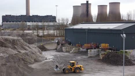 Aerial-view,-Lorry-checking-weigh-station-load-on-British-industrial-power-station-operation,-preparing-shipment