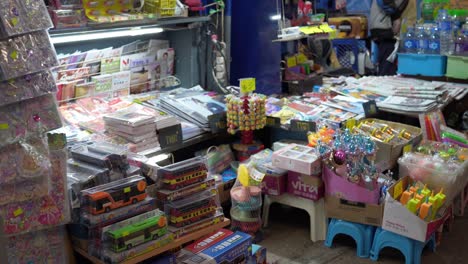 Overstocked-and-cluttered-Asian-newsstand,-Tsim-Sha-Tsui,-Hong-Kong