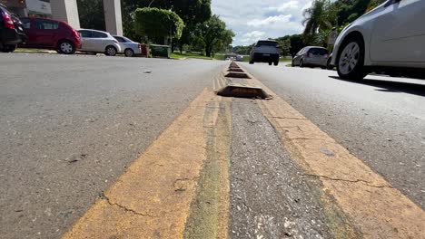 Low-angle-street-view-of-cars-on-Commerce-Street-in-Esplanade,-Brazil