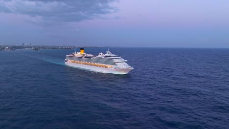 Costa-Pacifica-cruise-ship-navigating-in-Caribbean-sea-with-Santo-Domingo-port-in-background