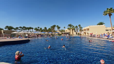 Vacationers-at-the-Beach-Albatros-Resort-in-Hurghada,-Egypt-doing-water-aerobics