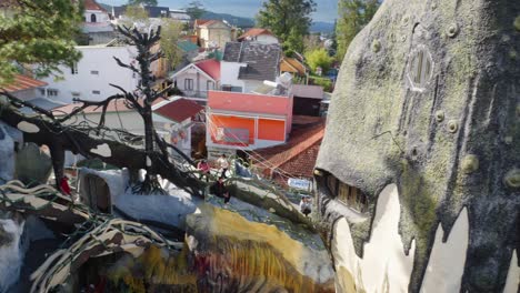 A-panoramic-shot-captures-the-unique-architecture-and-whimsical-design-of-Crazy-House-in-Da-Lat,-Vietnam,-revealing-the-intricate-details-of-the-building-and-its-surroundings