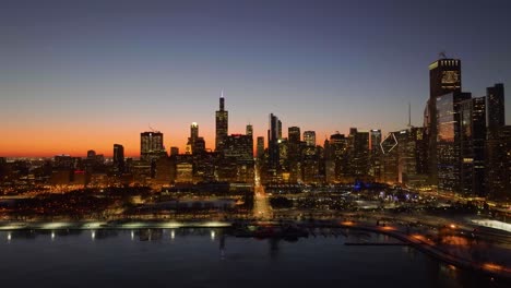 Aerial-view-approaching-the-East-Monroe-street,-colorful-dawn-in-Chicago-city,-US