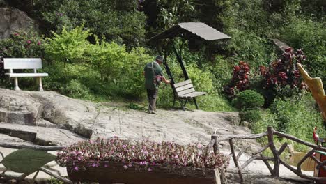 Male-Worker-Trimming-Grass-With-Grass-Cutter-At-The-Park-In-Vietnam