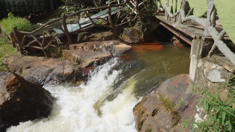 Tourists-Crossing-On-Wooden-Bridges-At-Datanla-Waterfall-Nature-Reserve-in-Da-Lat,-Vietnam