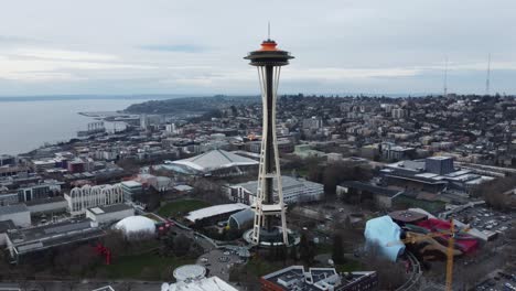 Aerial-Circle-Around-The-Iconic-Seattle-Space-Needle-Tower-In-The-Heart-Of-Downtown-Seattle,-Washington