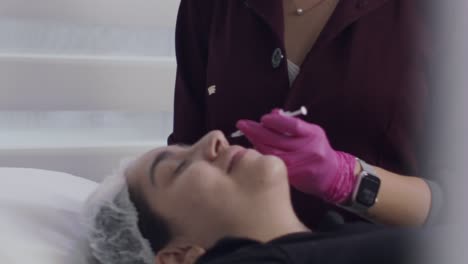 Close-up,-patient-getting-botox-injection-inside-clinic