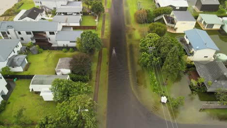 Bike-rider-going-through-flood-waters-after-Cyclone-Gabrielle