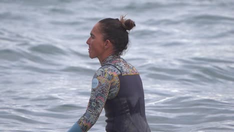 Gran-Canaria-Spain---February-9-2023:-Surfers-try-to-ride-waves-at-Las-Canteras-beach-in-Las-Palmas-de-Gran-Canaria,-Spain