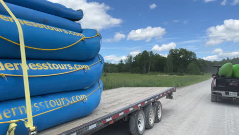 White-water-kayak-on-the-ottawa-river-during-peak-tourism-season---truck-bringing-rafts-to-the-trailhead