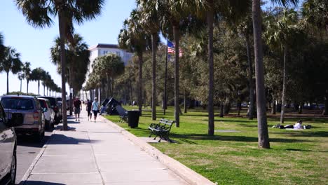 People-walking-along-the-battery-in-Charleston,-SC